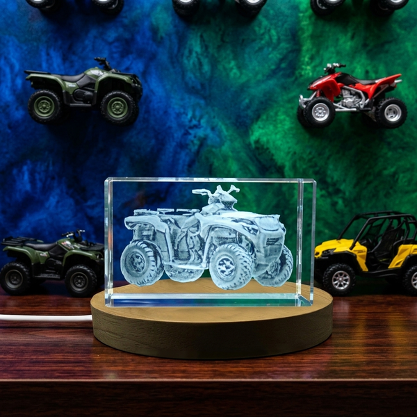 a car in a glass case on a wooden table